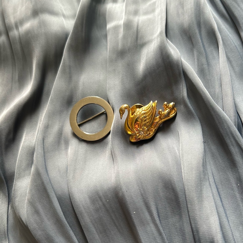 Gold Swan Badge and Monet Brooch